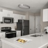 a kitchen with white cabinets