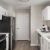 a kitchen with white cabinets